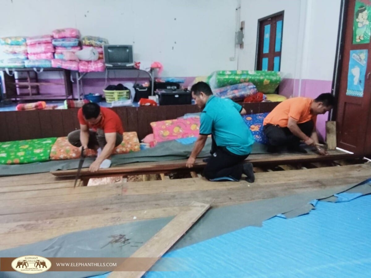 Fixing the dormitory floor to accommodate Karen hill tribe children